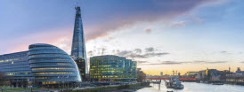 View of London at sunset from the Thames showing the Shard under construction