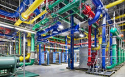 Interior view of a central plant with colour-coded piping