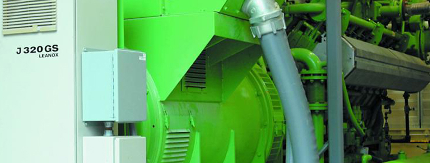 Close up view of a GE Jenbacher cogeneration unit installed in a central plant
