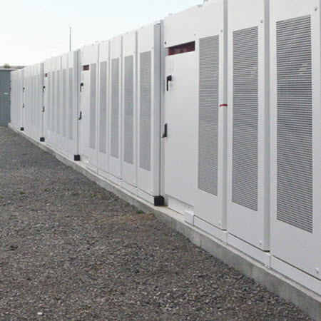 Daytime view of battery energy storage enclosures in Newmarket Ontario