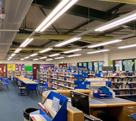 Daytime interior view of a library in West Lothian as seen from the main desk
